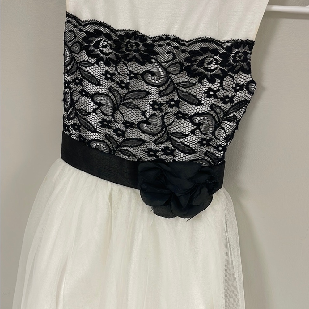 Elegant White Dress with Black Lace Detail